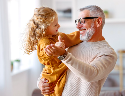 Man holding granddaughter Man holding granddaughter